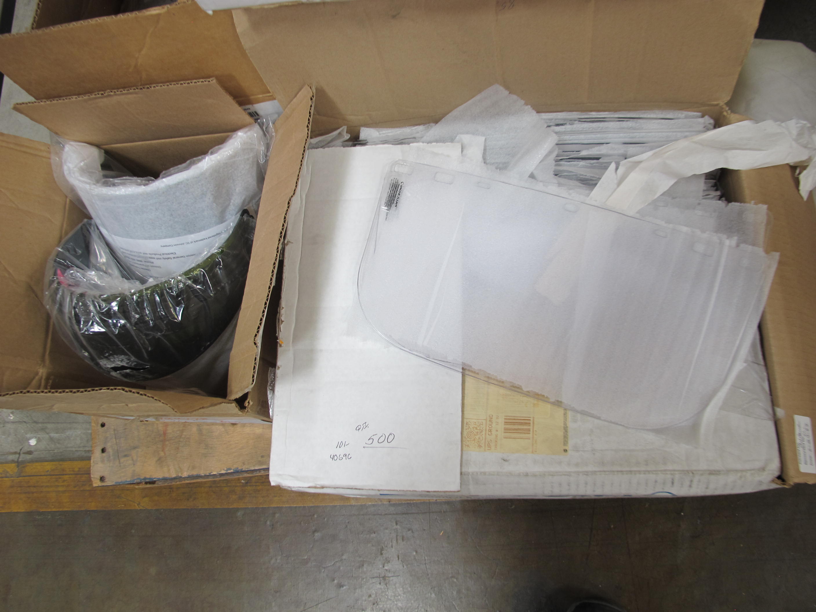 LOT TO INCLUDE: (500) VISORS, 8" LG X 0.06" THK SIZE, PLASTIC MATERIAL, CLEAR COLOR. SNAP-IN 100 PER BOX, (40) BRACKETS, 11" X 8" SIZE, VISOR KIND, PLASTIC MATERIAL, (15) SHIELDS, FACE KIND, 0.06" X 8" X 16" SIZE. WITH SPARK GUARD HEADGEAR, CLEAR POLY CARBONATE VISOR, RATCHETTYPE HEADBAND ASSEMBLY,. LOADING & HANDLING FEE $15-4221